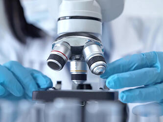 Scientist with microscope